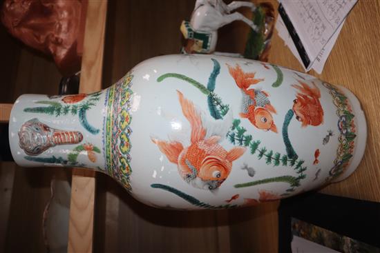 A Chinese famille verte vase, with twin elephant handles and decorated with shubunkins, restored height 22cm